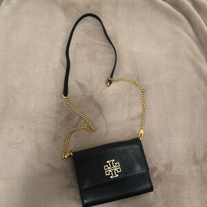 Tory Burch Black leather purse with gold chain and accents.